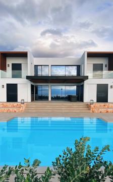 Outdoor remodeling with custom deck, lighting, and water feature