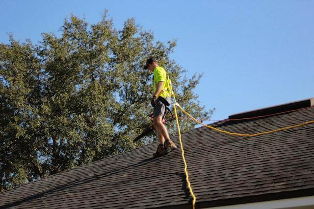 Roof repair service with patched leaks, re-shingled sections, and clear flashing