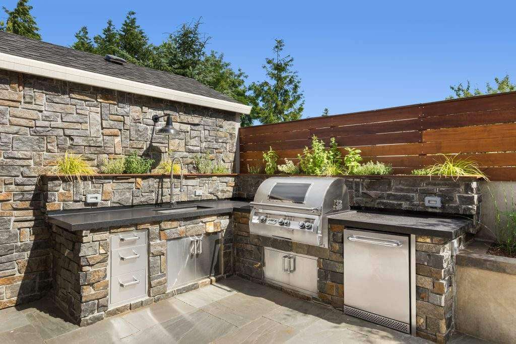 hardscape patio with custom outdoor kitchen